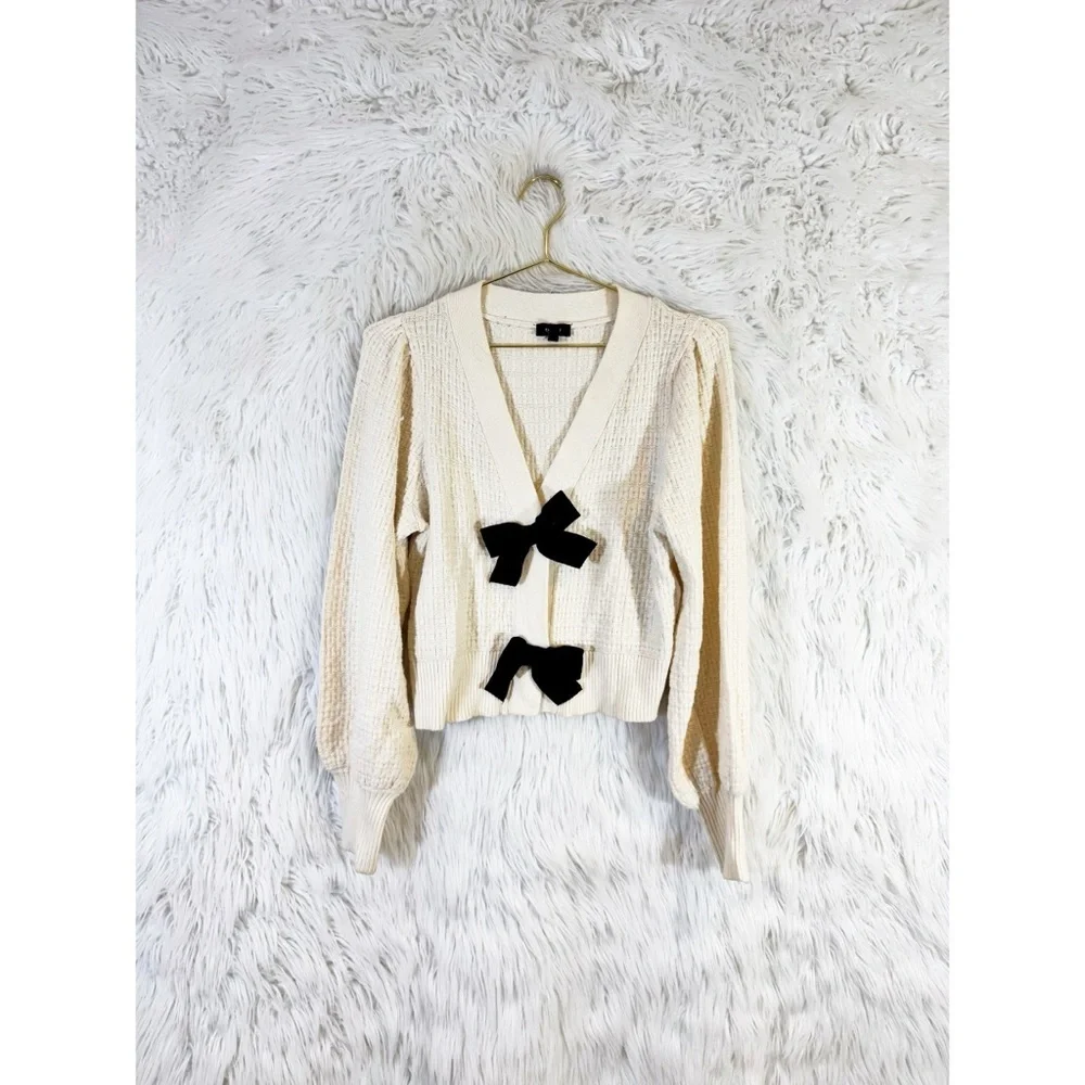 Express Cream Cardigan with Black Bow Details